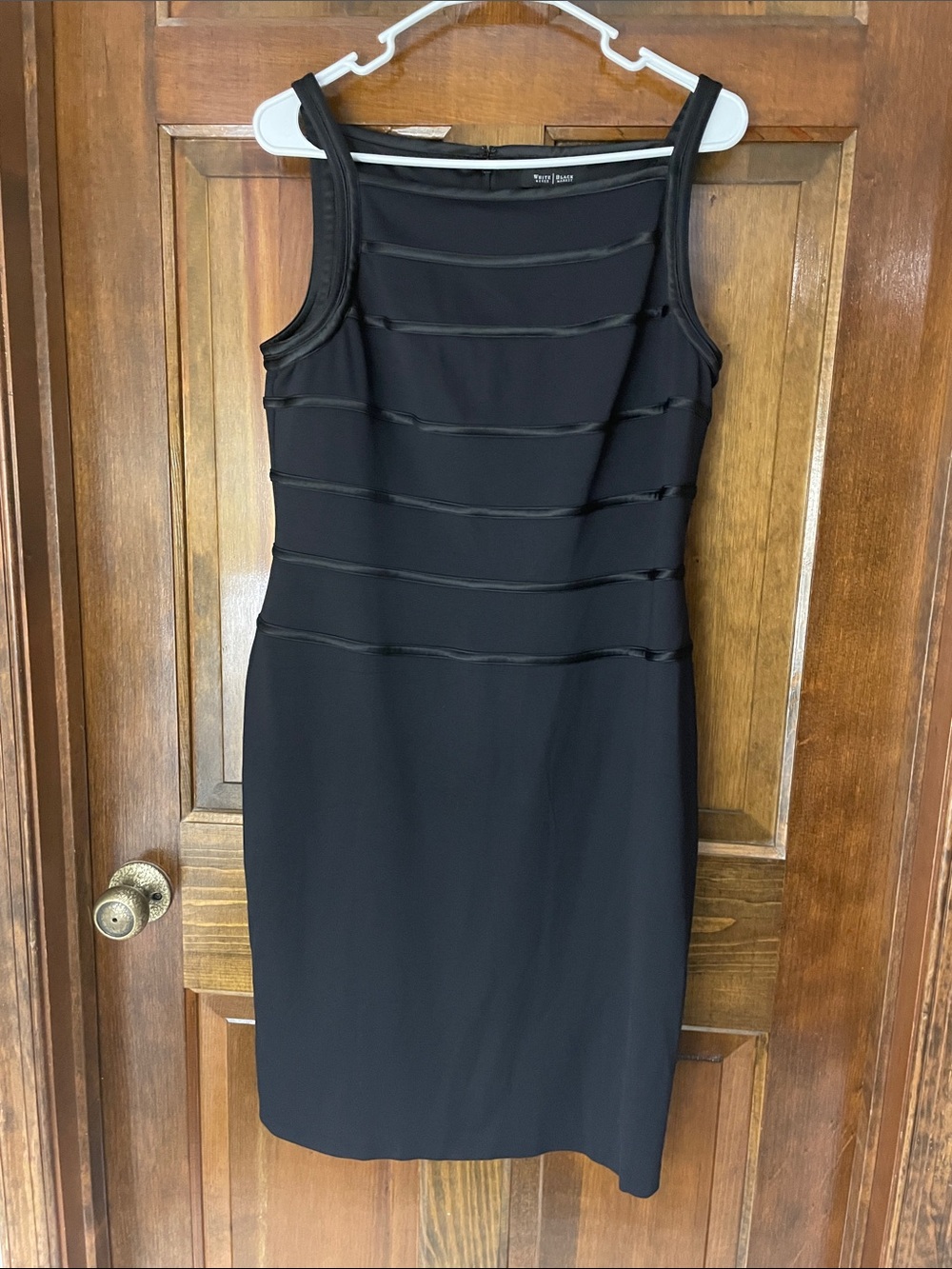WHBM black dress, knee length, satin line design on top and straps, size 12